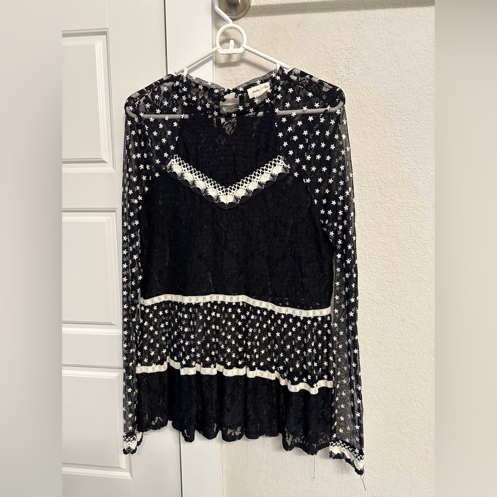 Black lace sheer blouse from Anthropologie.